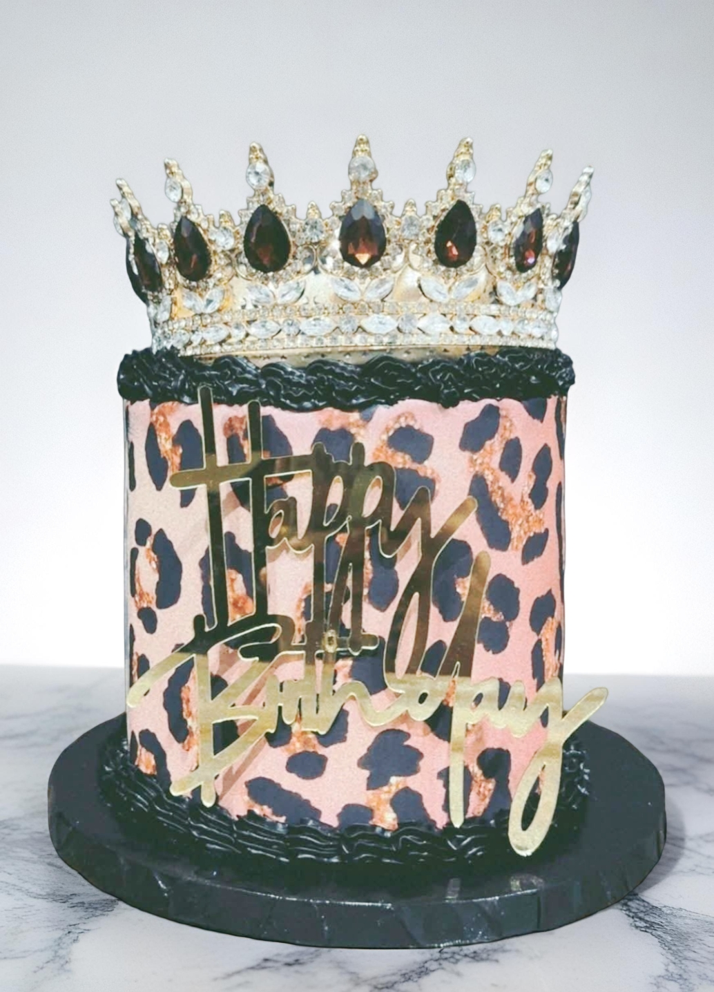 Leopard print birthday cake with crown topper