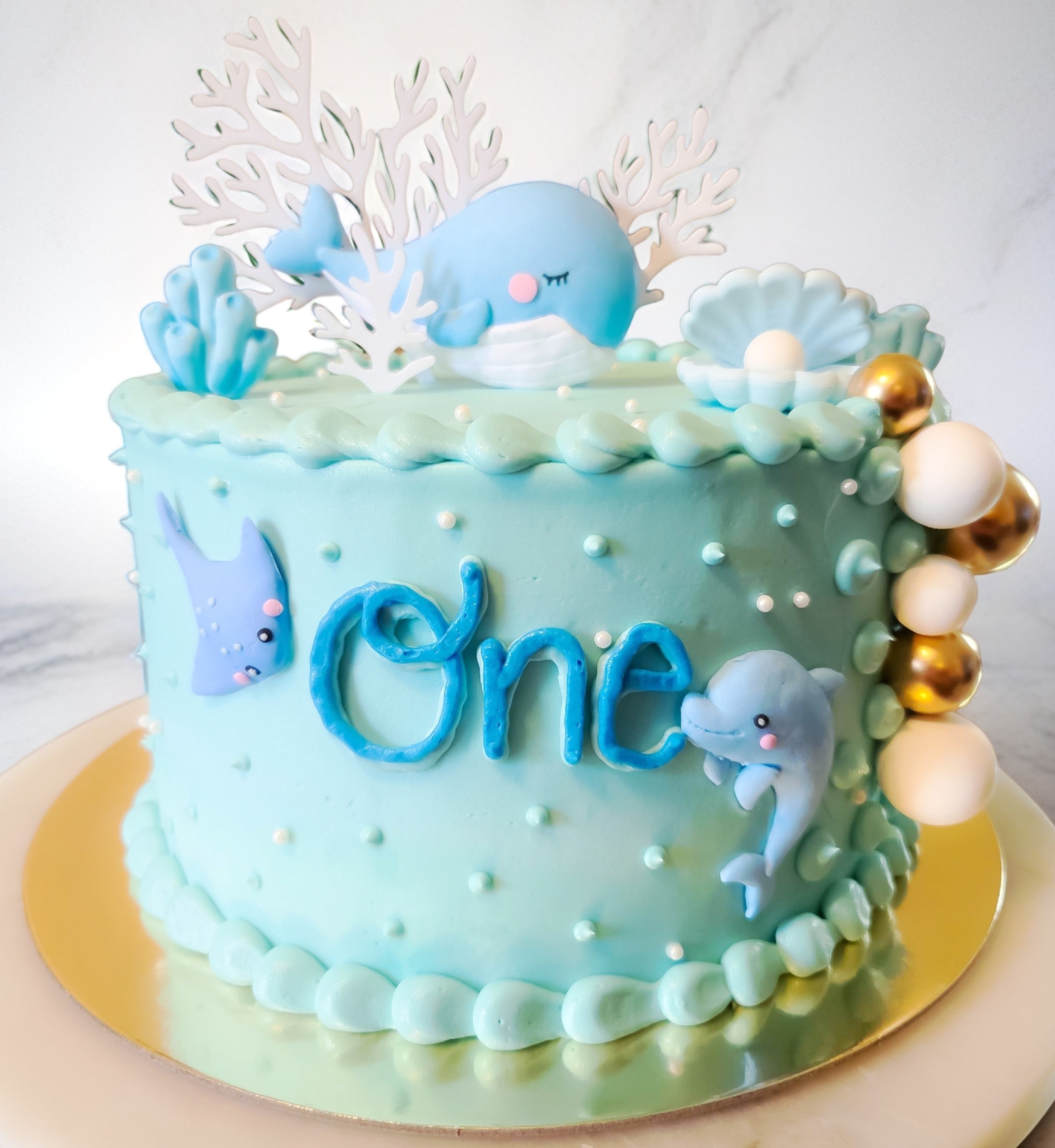 Ocean themed first birthday cake with whale