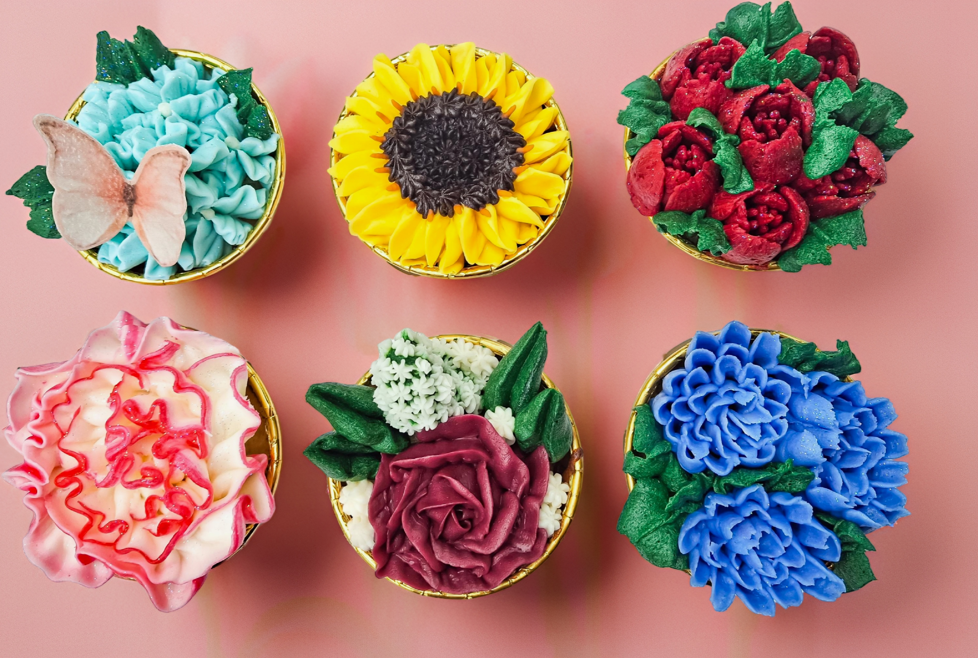 Colorful flower bouquet cupcakes with sunflower and rose designs