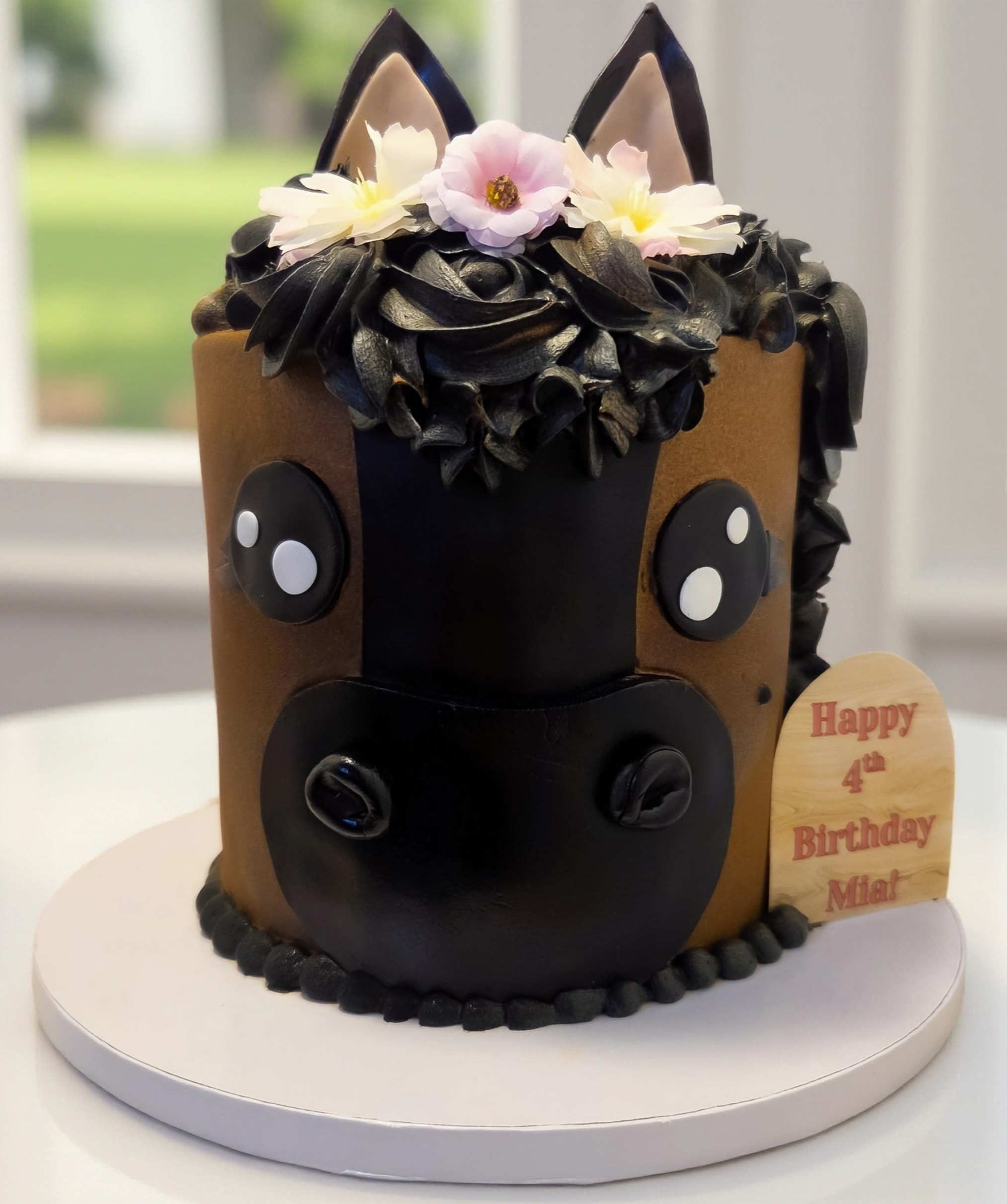 Cat face birthday cake with flowers